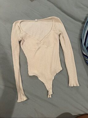 Ribbed V-Neck Long Sleeve Bodysuit in Cream